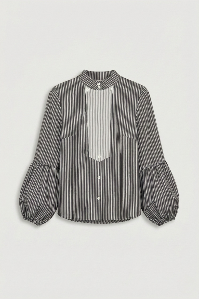 Camisa de algodón de rayas en color negro con manga larga abullonada y puño engomado.